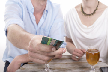 young couple pays the bill