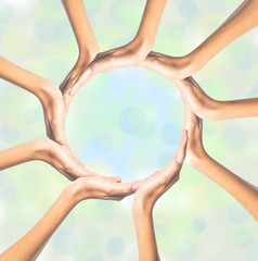 Human hands making circle on bright background