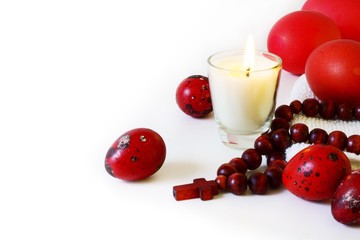 Easter eggs with candle and rosary