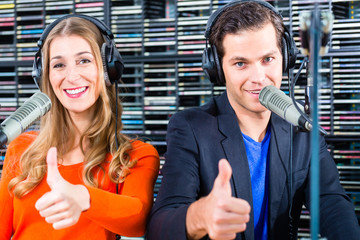 radio presenters in radio station on air