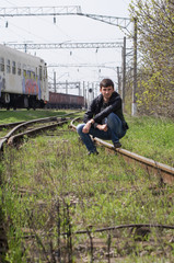 The young man smiles close up