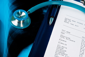 Blood test results in a clipboard with stethoscope
