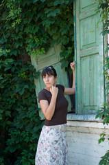 Fototapeta premium Young beautiful girl on a walk in the country