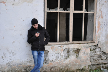 The young man smiles close up