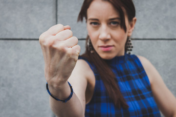 Pretty girl showing her fist
