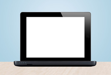 Laptop and cactus in flowerpot on wooden table on grey backgroun