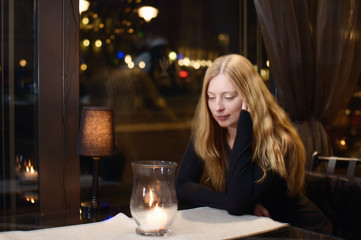 Thoughtful lady in a cafe