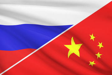 Series of ruffled flags. Russia and China.