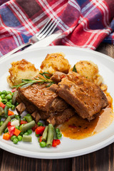 Pork spareribs served with mashed potatoes