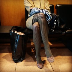 Elegant Lady waiting in the boarding area of an airport