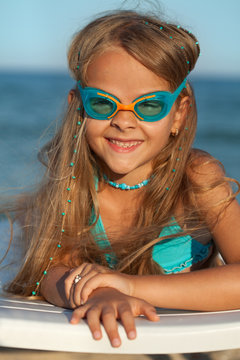 Little girl with swimming goggles