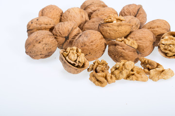 walnut and a cracked walnut isolated on the white background