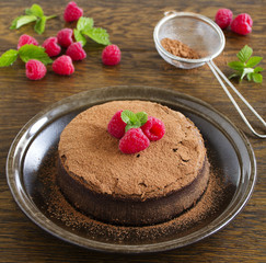 Truffle chocolate cake with raspberries.
