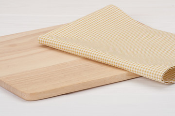 Natural Cotton Napkin And Wooden Board On White Painted Wood Bac