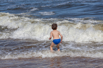 Kid playing on a beach