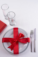 Red ribbon table set with glasses