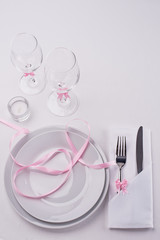 White and pink festive table set for restaurant menu