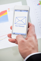 New email message icon on a mobile phone