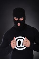 Hacker with an internet domain symbol - obrazy, fototapety, plakaty