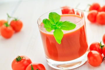 Fresh tomato juice wooden background