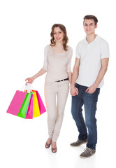Couple With Shopping Bags Over White Background