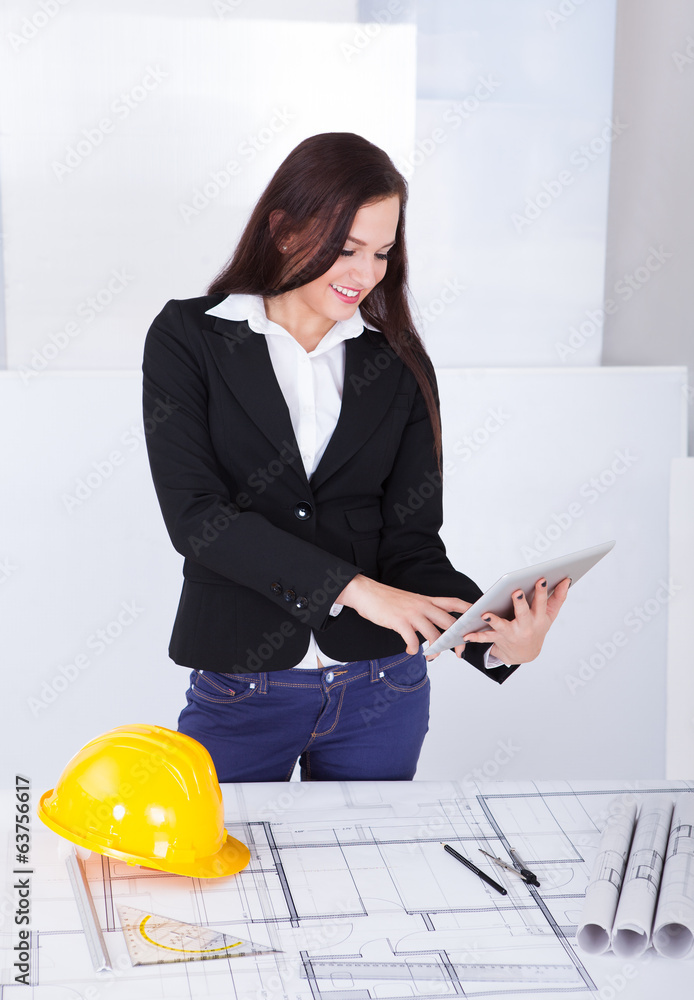 Aufkleber architect with digital tablet standing at desk
