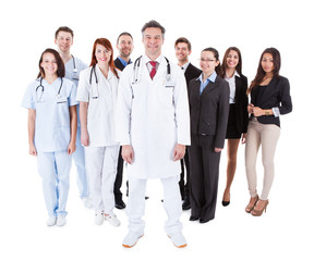 Doctor standing in front of his team