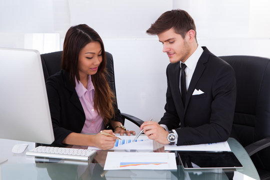 Business People Analyzing Graph