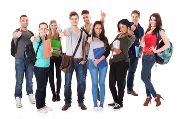 Obraz premium Confident University Students Walking Over White Background