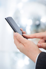 Businesswoman's Hands Using Smartphone