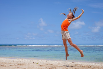 flying jumping beach girl at blue sea shore in summer vacation i