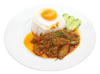 savory curry pork and white rice with egg on top