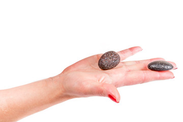 female hands holding a stones, spa theme