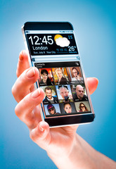 Naklejka na ściany i meble Smartphone with transparent screen in human hands.