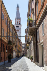medieval street in old town of Modena, Italy