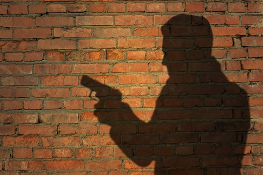 Human silhouette with handgun