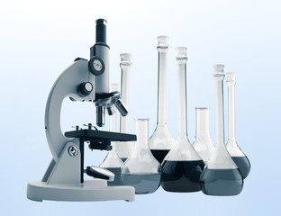 Laboratory metal microscope and test tubes with liquid toning in