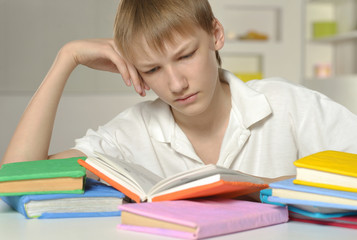 Fototapeta premium Boy is doing homework