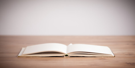Open book on wooden deck