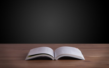Open book on wooden deck