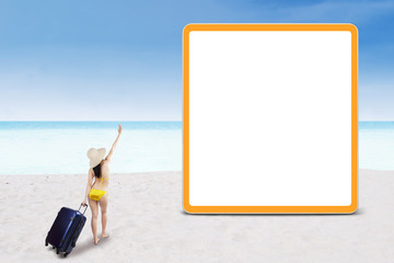 Sexy woman walking to billboard