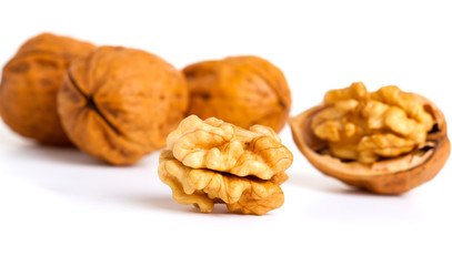 walnut and a cracked walnut isolated on the white background