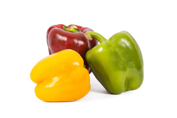 red green and yellow pepper isolated on white