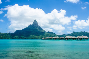 Overwater bungalows in Bora Bora with view of Mount Otemanu - 63777624