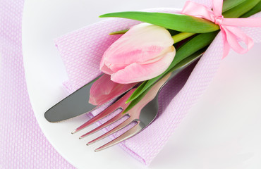 Romantic dinner / table setting with roses tulips and cutlery, o
