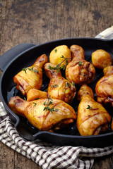Roasted chicken legs and potatoes