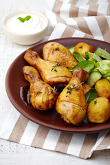 Roasted chicken legs and potatoes