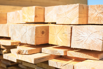 Pile of wood on the ground and on store shelves