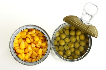 green peas and corn in a can on a white background