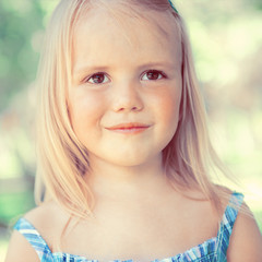 Cute little girl on the meadow in summer day © Milles Studio